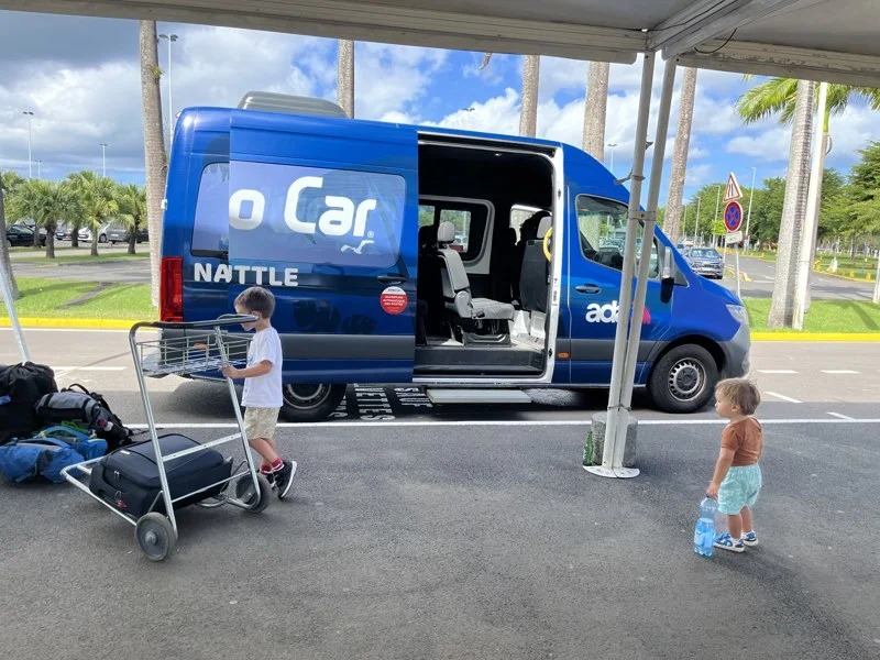 Blue car hire shuttle at the airport in Guadeloupe
