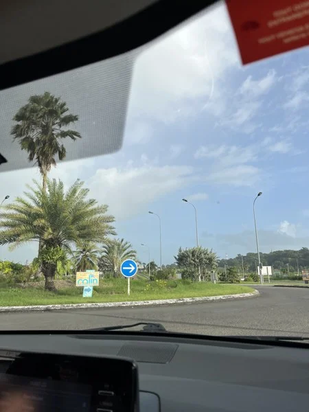Roundabout viewed through a car windscreen in Guadeloupe