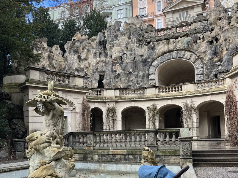 The artificial grotto in Grébovka park with a fountain in front