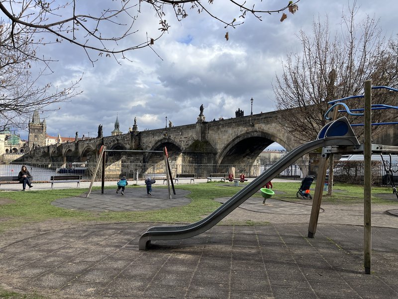 A children's slide at the playground beside Charles Bridge