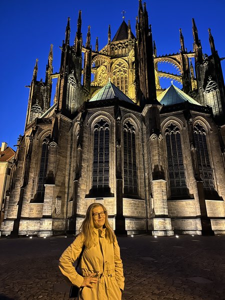Illuminated St Vitus Cathedral with the author in the foreground