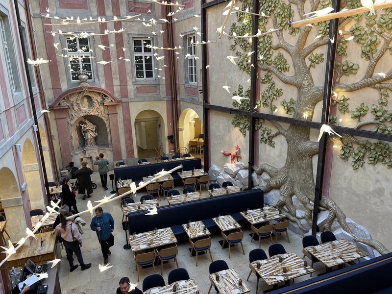 Daylit interior of restaurant 420 under a glazed roof