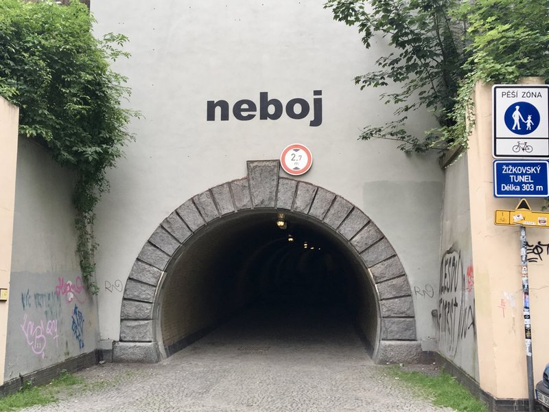 Entrance to the Žižkov pedestrian tunnel with the word neboj
